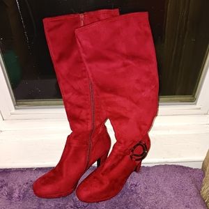 A brand new pair of impo burgundy knee high boots size 8